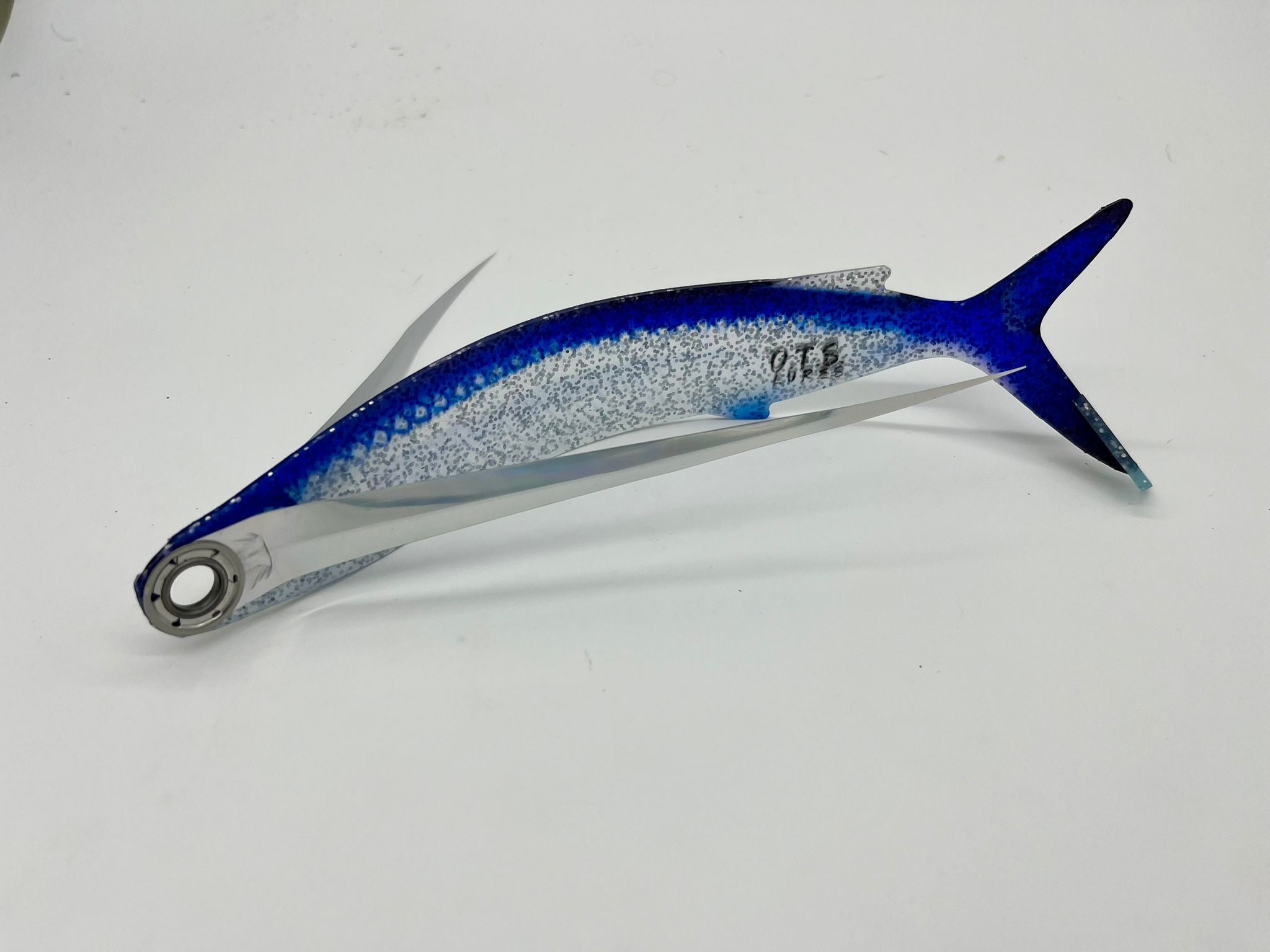 OTS Flaps- UV Dredge Flaps - Condition:New. UV Flaps with a realistic look In a dredge or a chain, mud flap style teasers work well and have been a timeless, popular item for offshore anglers.
